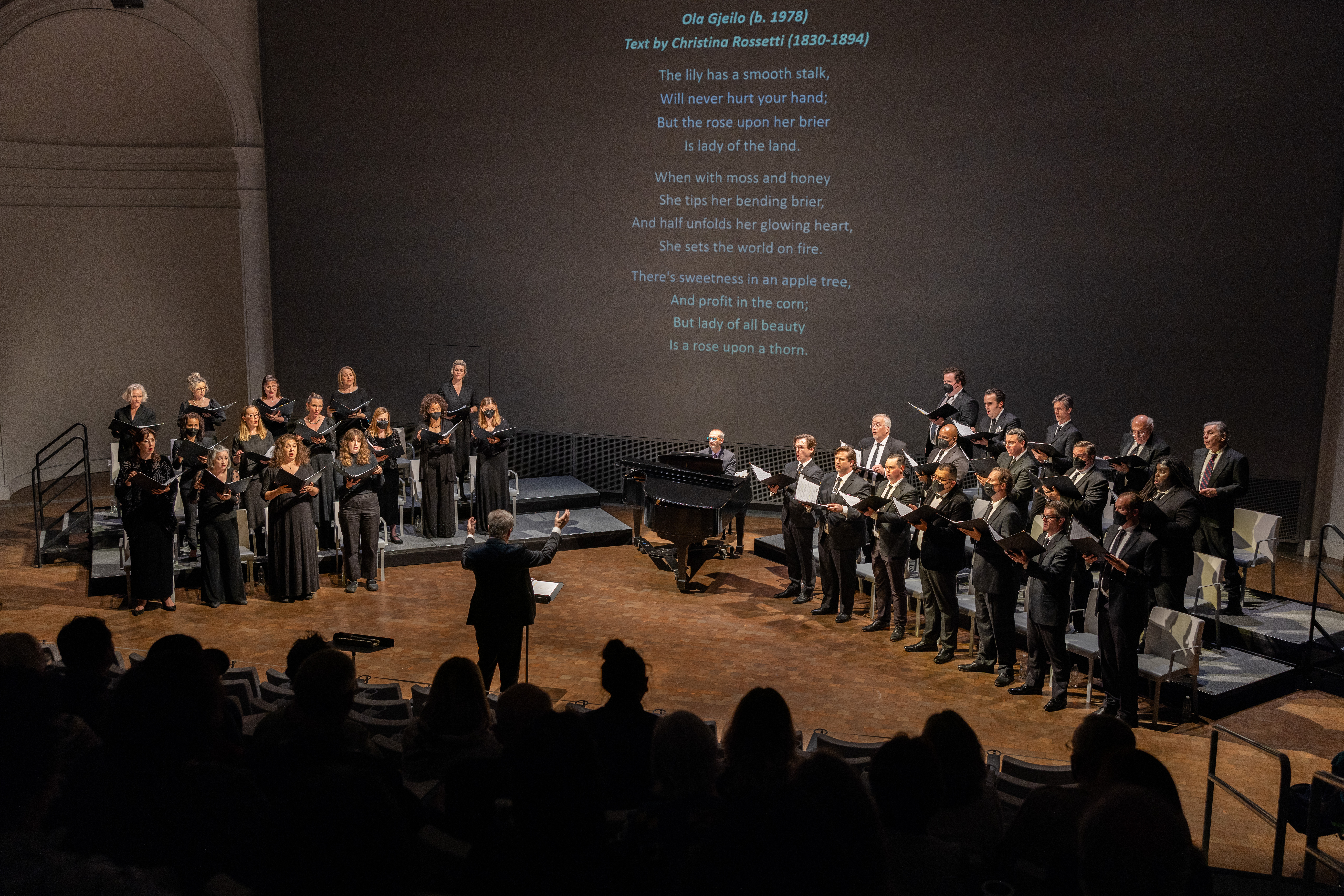 Members of the SF Opera chorus standing and singing