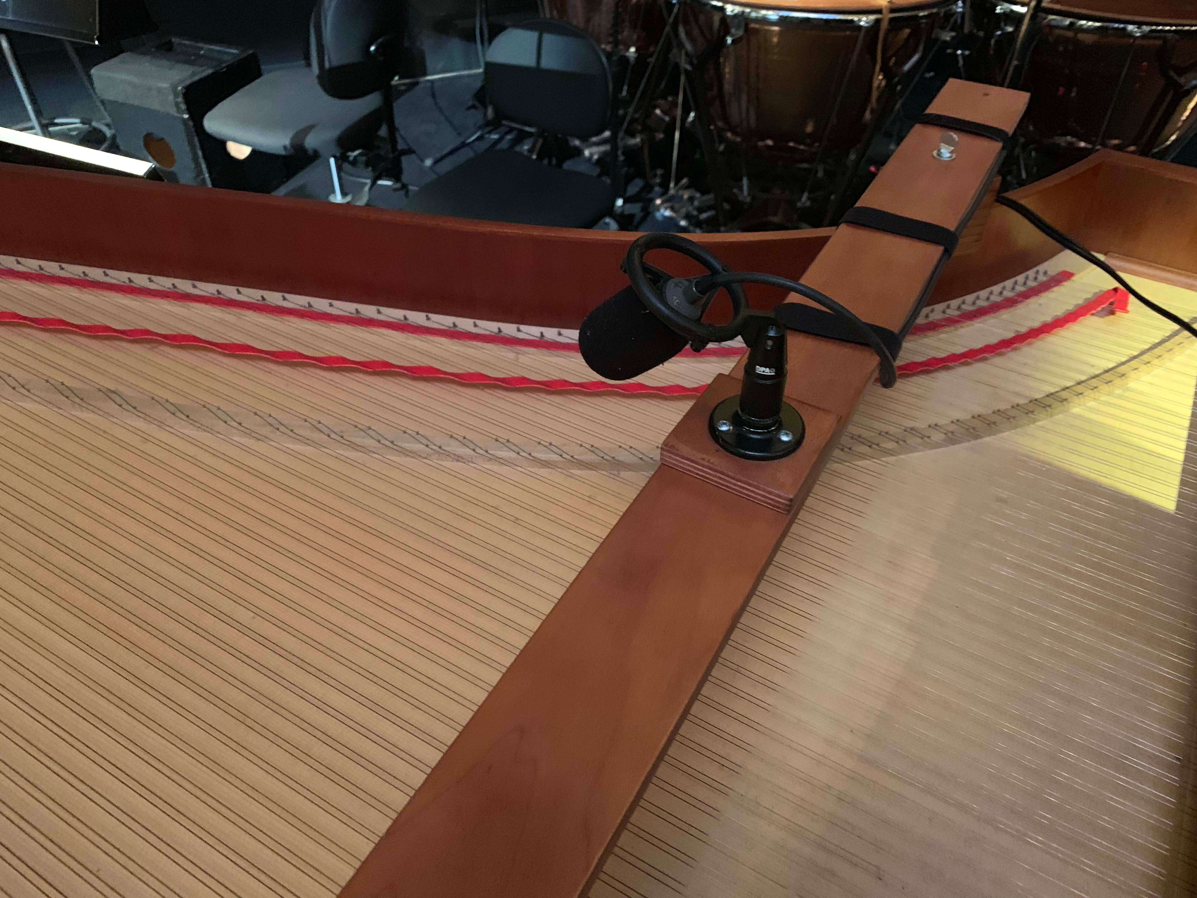 As the continuo fortepiano is not the loudest instrument and doesn’t always carry naturally back towards the stage, we relay it back onto the stage through ‘monitors’ so that the singers can hear it more clearly. Here you can see the microphone that will pick up the instrument.
