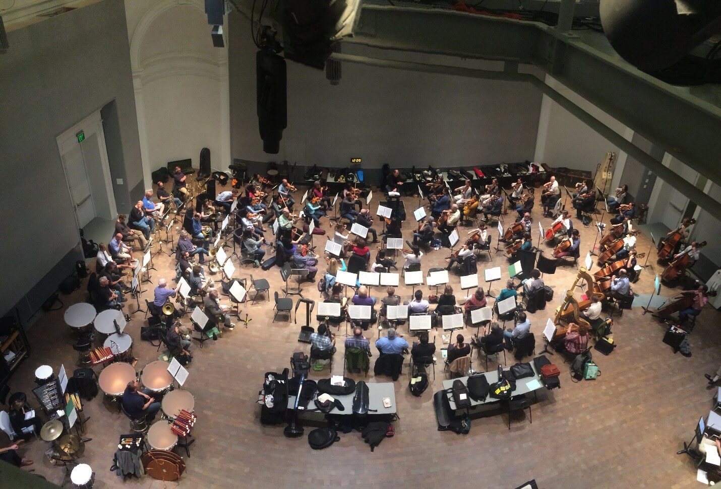 The might of the San Francisco Opera Orchestra in a Sitzprobe rehearsal in the Taube Atrium of the Wilsey Center.