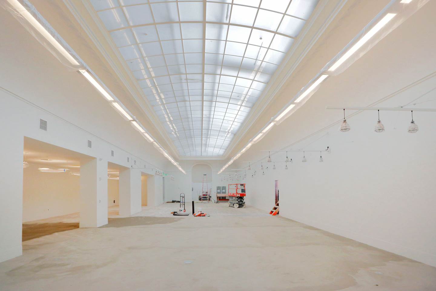 large empty white room with glass ceiling