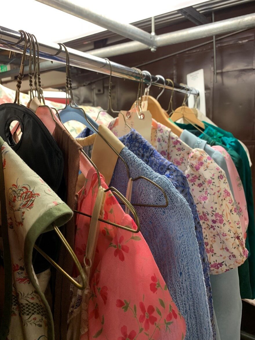 Andriana Chuchman’s costumes for Mary Hatch, arrayed on a rack in the basement of the Opera House.