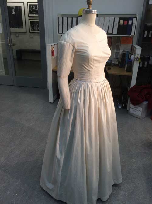 A muslin mock-up, allowing for adjustments to be made before the dress is made out of real fabric.