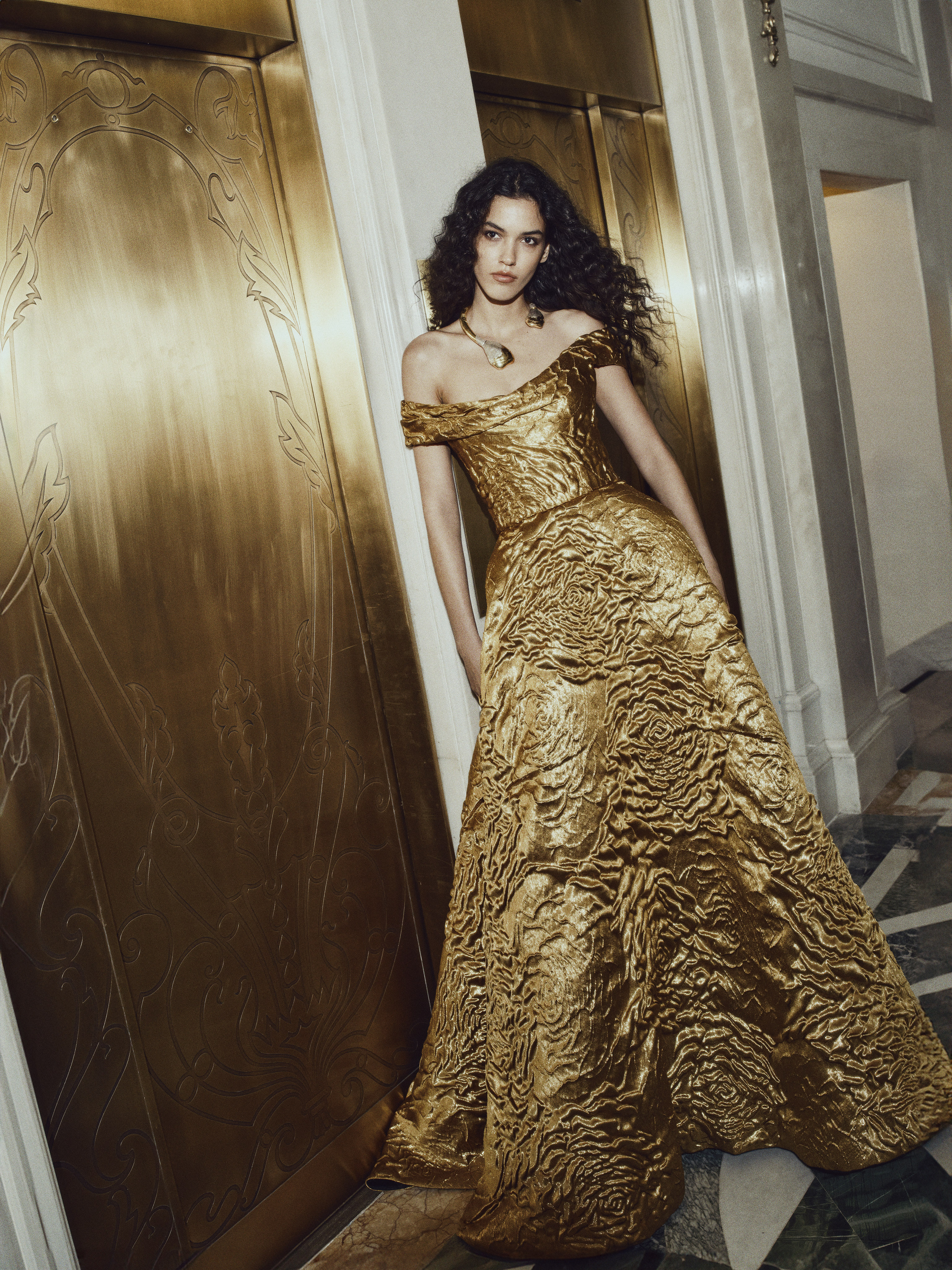 woman dressed in a gold gown