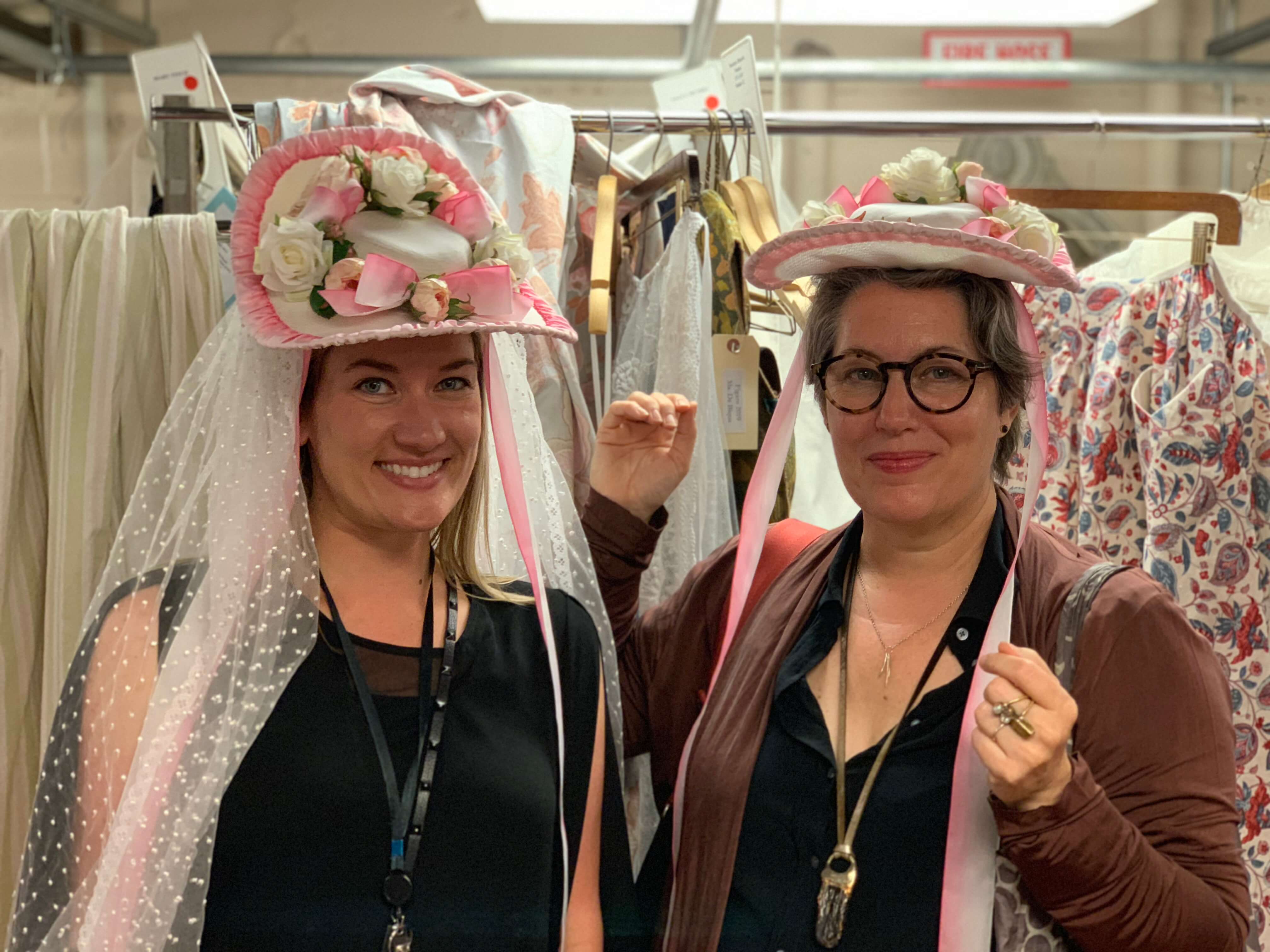 Galen and Constance showing the location of the magnets in two versions of Susanna’s wedding hats, and showing off the hats!