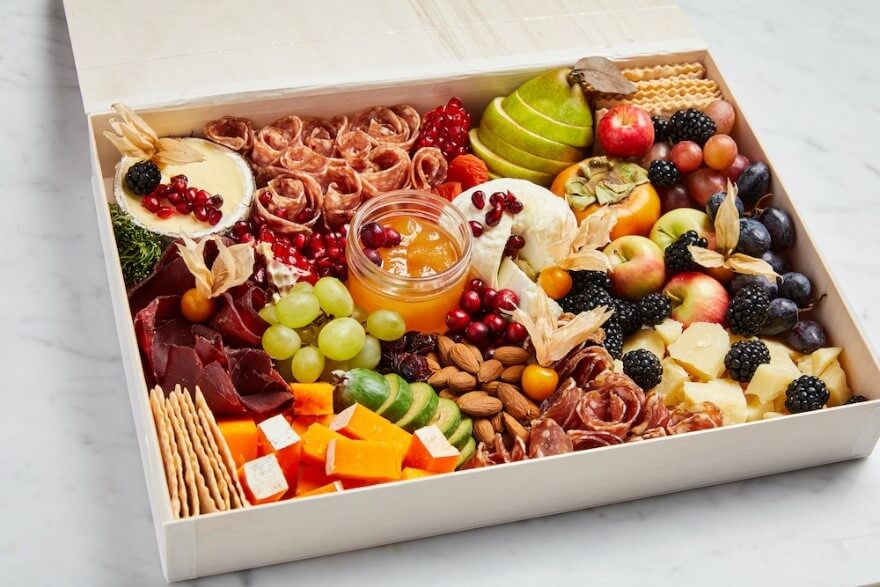 Snack box with fruit, cheese, crackers and nuts